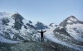 Traveller enjoying incredible starry night in the mountains in Switzerland Alps