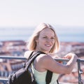 Traveller female on the background of the panorama of Lisbon.