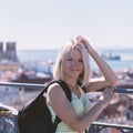 Traveller female on the background of the panorama of Lisbon.