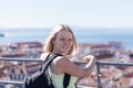 Traveller female on the background of the panorama of Lisbon.