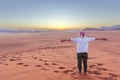 Traveller girl enjoying the sunset in the Wadi Rum desert in Jordan Royalty Free Stock Photo