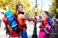 Traveller girls with backpack wallking on European cultural city
