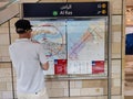 Traveller looking at route map at metro station dubai