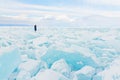 Traveller looks to a field of ice covering Baikal lake in winter. Royalty Free Stock Photo