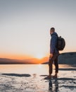 Traveller man with backpack in Pamukkale enjoying the awesome sunset in the travertines Royalty Free Stock Photo