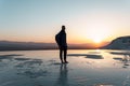 Traveller man with backpack in Pamukkale in the middle of sunset in travertines Royalty Free Stock Photo