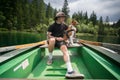 Traveller man with best friend dog on boat Royalty Free Stock Photo