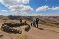 A traveller at Palccoyo rainbow mountain Vinicunca alternative, mineral colorful stripes in Andean valley, Cusco, Peru, South