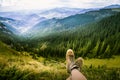 A traveller resting in a mountain landscape in Carpathian mountains Royalty Free Stock Photo