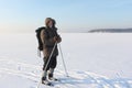 The traveller's portrait with a beard on skis on a snow