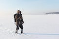 The traveller's portrait with a beard on skis on a snow