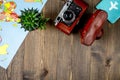 traveller set with camera and map on wooden background top view mock-up Royalty Free Stock Photo