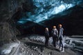 traveller standing in Ice cave of Jokullsarlon south Iceland in