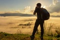 The traveller standing shooting photo foggy landscape aerial vie