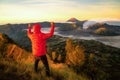 Traveller success for treking to top of mountain to see a sunrise for Bromo vocano Royalty Free Stock Photo