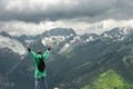 Traveller and summer mountainHappy traveller on the top of mountain stormy landscape Royalty Free Stock Photo