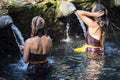 Traveller take a bath at Holy Spring Water Tirta Empul Hindu Temple , Bali Indonesia. Royalty Free Stock Photo