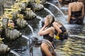 Traveller take a bath at Holy Spring Water Tirta Empul Hindu Temple , Bali Indonesia. Royalty Free Stock Photo