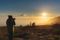 Traveller taking photograph of sunrise view on the mountain in the morning. Travel lifestyles