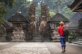 A traveller travel in Holy Spring Water Tirta Empul Hindu Temple Royalty Free Stock Photo