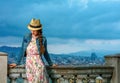 Traveller woman in front of city panorama of Barcelona, Spain