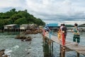 travellers on bridge at Chedi Hua Laem pagoda, Chanthaburi