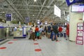 Travellers at international airport waiting for check in Royalty Free Stock Photo