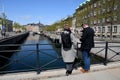 Travellers standing on stormbroen in danish capital Copenhagen
