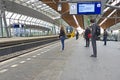 Travellers waiting for the train in Bijlmer station Amsterdam Netherlands