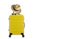 Travelling concept with yellow luggage with hat and yellow sun glasses