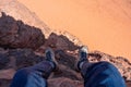Travelling, hiking and adventurous in desert Middle-East. Traveler enjoying high angle view of desert landscape in Jordan