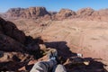 Travelling, hiking and adventurous in desert Middle-East. Traveler enjoying high angle view of desert landscape in Jordan