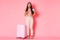 Travelling, holidays and vacation concept. Full-length of happy smiling asian girl tourist standing near suitcase Royalty Free Stock Photo