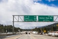 Travelling on the interstate through the Sierra mountains, close to Lake Tahoe; snow covered mountains and storm clouds; Truckee,