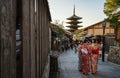 Travelling in Japan. Kyoto landmark, Yasaka Pagoda with people in Kimono and tourists in Kyoto, Japan