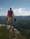 Man wearing brown hat, t-shirt, shorts and sandals with backpack Royalty Free Stock Photo