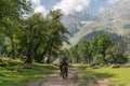 Travelling in summer, backpacker riding horse in summer at Sonamarg, Jammu and Kashmir India Royalty Free Stock Photo