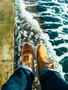 Travelling wearing yellow shoes at the seashores Royalty Free Stock Photo