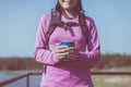 Travelling woman hands holding a glass of warm coffee in the morning at outdoor,Camping hiking concept Royalty Free Stock Photo