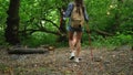 Travelling in woodland, man and woman are on halting