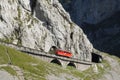 Travelling with the world strongest rise cog railway with up to 48% grade driving up mount Pilatus at Lake Lucerne