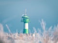 The TravemÃÂ¼nde lighthouse in winter and the sky is cloudless and blue Royalty Free Stock Photo