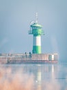 The TravemÃÂ¼nde lighthouse in winter and the sky is cloudless and blue Royalty Free Stock Photo