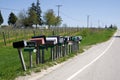 TRAVERSE CITY, MICHIGAN, UNITED STATES - May 16, 2018: Multiple American mailboxes along road in countryside area of Royalty Free Stock Photo