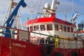 Trawler berthed in a harbor in Ireland taking shelter during a storm in the Irish Sea Royalty Free Stock Photo