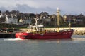 Trawler coming to its berth in a harbor in Ireland taking shelter during a storm in the Irish Sea Royalty Free Stock Photo