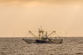 Trawler with dragnet fishing in the Wadden Sea Royalty Free Stock Photo