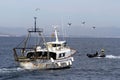 Trawler fishing boat ready to use nets.