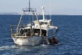 Trawler fishing boat ready to use nets.