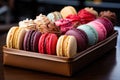 A tray of assorted macarons on a table